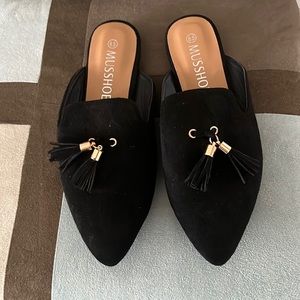 Black mule flats with tassel detail, size 6.5